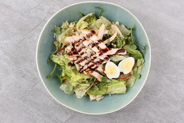 Salad with chicken breast and unagi sauce for the restaurant