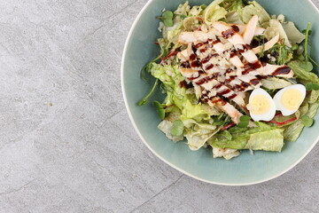 Salad with chicken breast and unagi sauce for the restaurant