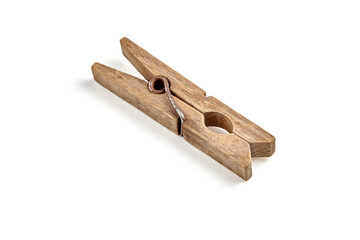Wooden clothespin with rusty spring isolated on white background