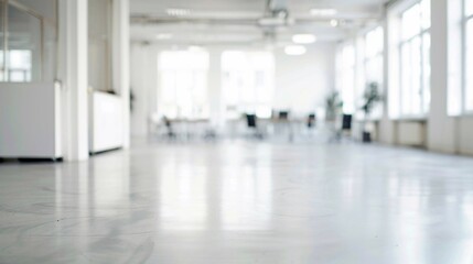 Blurry image of a spacious white office with open layout, modern design