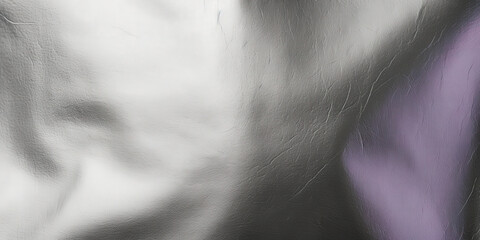 A stunning silver textured background with a metallic shine and crumpled foil effect, ideal for elegant and modern designs, luxury products, and stylish presentations..