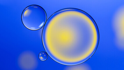 top view of macro abstract photography of oil droplet over blue background