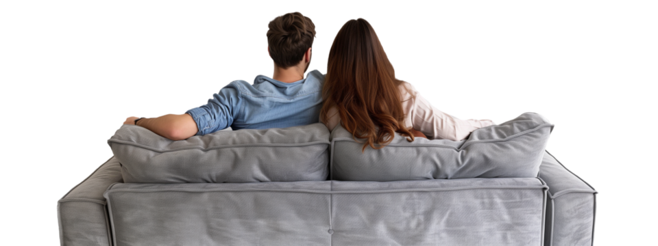 A young couple, their backs to the viewer, probably watching TV, share a moment of quiet intimacy on a modern couch. Transparent png, add your own background.