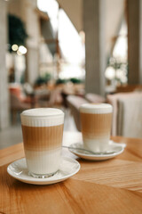 Cup of latte in a restaurant, good morning