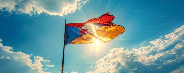 Democratic Republic of Congo flag against a bright, blue sky