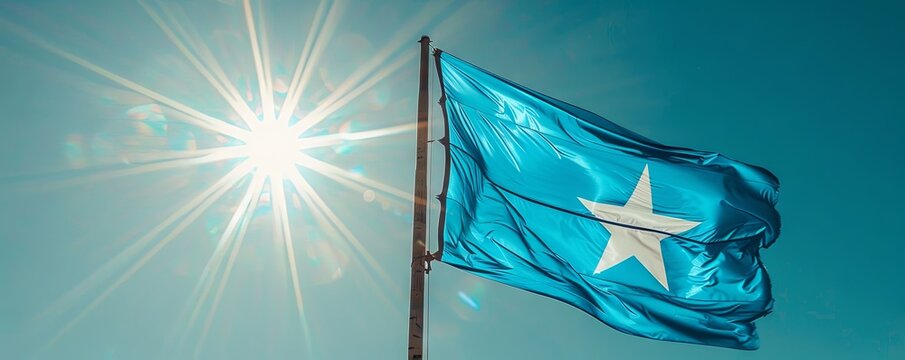 Somalia flag waving against a clear, sunny sky