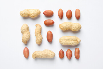 Fresh peanuts on white background, flat lay
