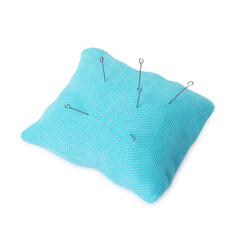 Light blue pincushion with sewing needles isolated on white