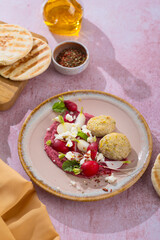 Savor a Mediterranean meal with hummus, falafel, and veggies for a healthy option