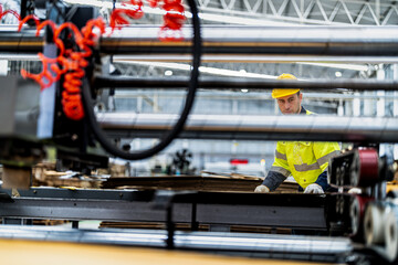Fototapeta premium technician engineers checking the process on Heavy machine. mechanical engineering team production. Industry manufacturing. Worker holding tablet and folde. High technology production.