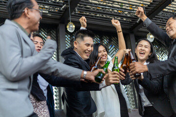 Happiness smiling Businesspeople on New Year Party in Office and celebrating of New Year small group at restaurant.