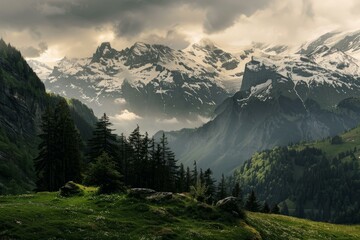 Sunlight piercing through clouds over snowcapped peaks and lush valleys