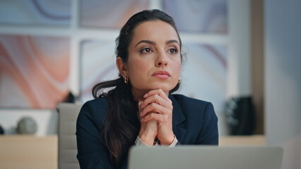 Sad woman thinking office at computer table closeup. Tired executive pondering