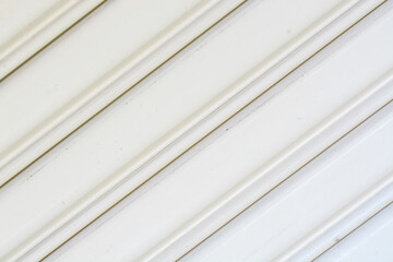 the unique texture of the garage, enhanced by its stainless steel wallpaper background