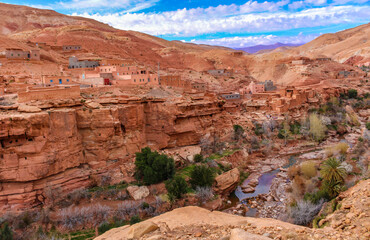 Fototapeta premium .Traditional Berber village in the Atlas mountains, traditional mountain houses and a canyon wit a small river