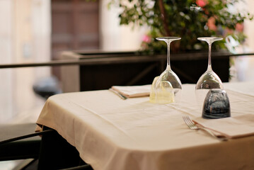 Clean Shiny Wine Glasses On Table Covered With Tablecloth