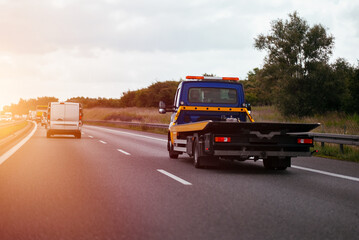 Fototapeta premium Tow Towing Empty Truck On Intercity Highway