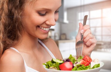 Healthy Meal. Happy Woman Eating Fresh Salad