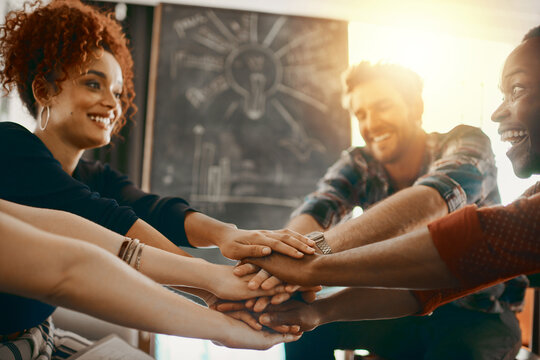 Business people, hands stack and support together for collaboration with trust and team building in agency. Workplace community, employees and huddle for solidarity and cooperation with partnership