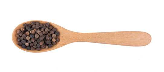 Black pepper corns in wood spoon isolated on transparent png top view