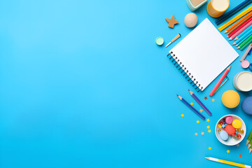 School and office supplies on blue background. Top view with copy space
