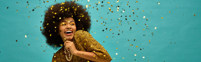Trendy African American woman with curly hairdohairstyle surrounded by colorful confetti.
