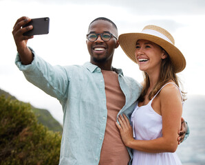 Man, woman and road trip selfie with love in nature, travel and countryside for vacation in Brazil. Hug, interracial couple and happy using phone for picture for holiday, journey and smile together