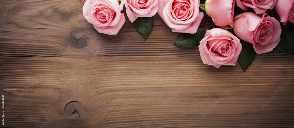 Leinwandbilder Pink roses and a heart shape decoration placed on a wooden table, creating a lovely and rustic display. with copy space image. Place for adding text or design