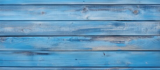 Obraz premium Weathered blue wooden wall with peeling paint, creating a vintage textured background. with copy space image. Place for adding text or design