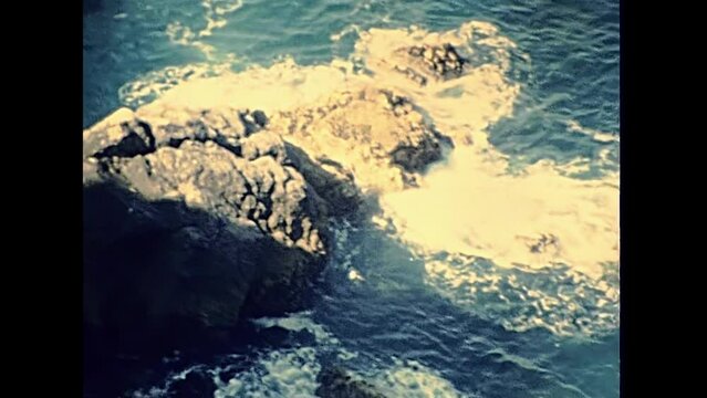 Aerial view of reef coastline from top of Pointe de Pen-Hir hill in the 70s. Archival footage of Brittany from 1976 in France in the Crozon peninsula.
