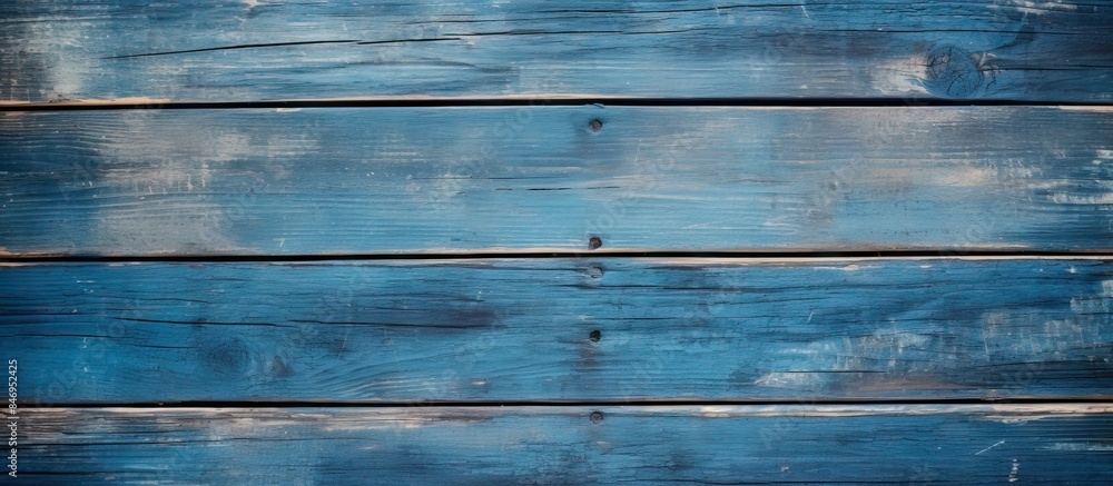 Poster close-up view of a weathered blue wooden wall surface showing signs of age and wear. with copy space