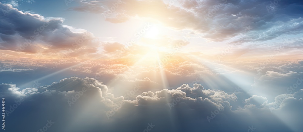 Aufkleber Sunshine penetrates fluffy clouds, casting dramatic rays of light from above the misty atmosphere. with copy space image. Place for adding text or design