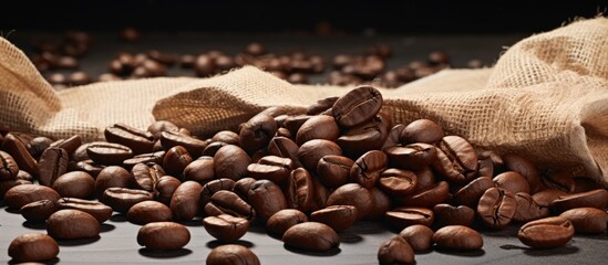 Various types of coffee beans spread out on crumpled paper, showcasing a diverse selection. with copy space image. Place for adding text or design