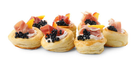 Delicious puff pastry with cream cheese, ham, black caviar and peach isolated on white