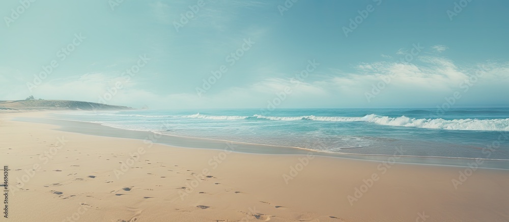 Poster Individual walking along the shore carrying a surfboard while enjoying the seaside view. with copy space image. Place for adding text or design