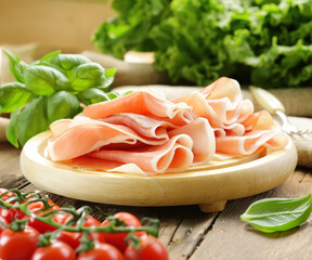 organic prosciutto jamon on wooden board