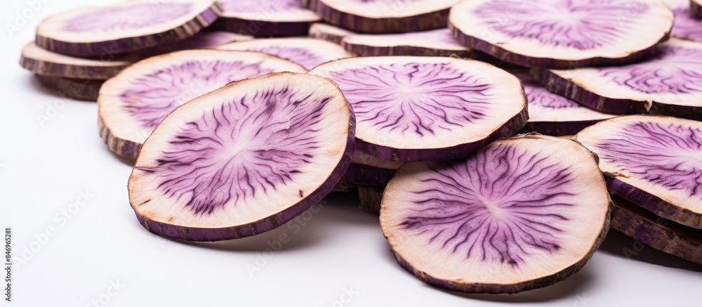 Poster a close-up view of a stack of thinly sliced purple potatoes arranged neatly on a clean white tableto