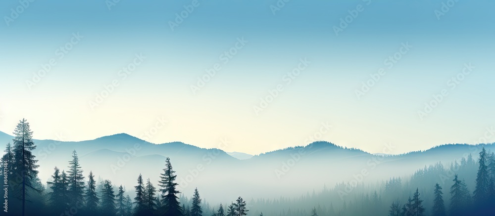 Leinwandbilder Silhouetted misty mountains against blue sky and green forest with pines and fir trees create a desire to camp in the wild. with copy space image. Place for adding text or design