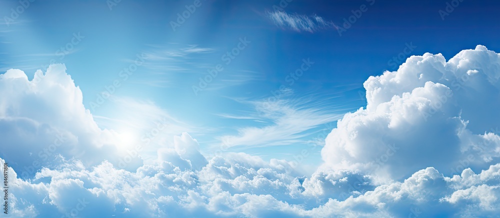 Poster Up in the sky, a plane gracefully maneuvers through the fluffy clouds in a sunny atmosphere. with copy space image. Place for adding text or design