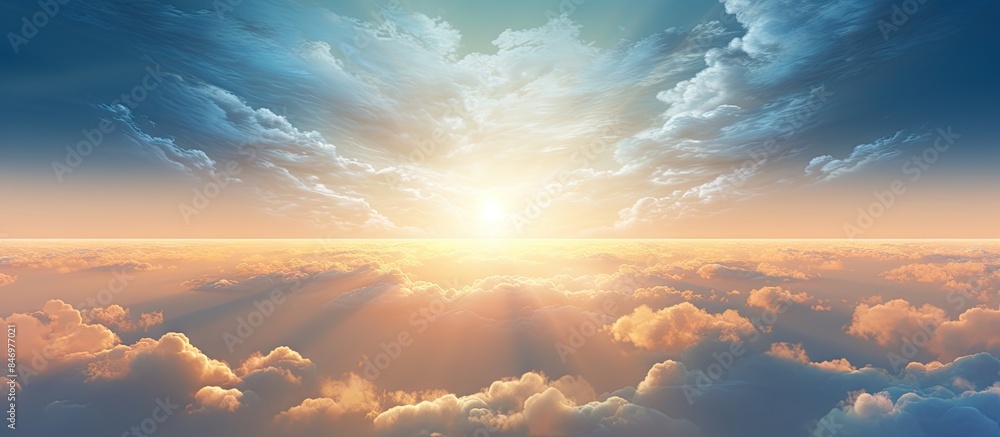 Leinwandbilder sun emits light over fluffy clouds during sunrise creating a picturesque scene in the sky. with copy