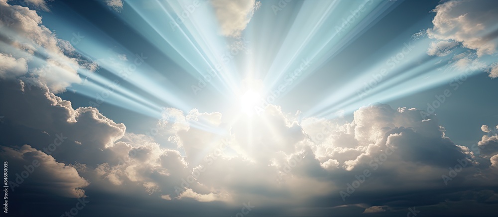 Poster Bright sunlight shining through thick overcast sky with visible sun rays. with copy space image. Place for adding text or design