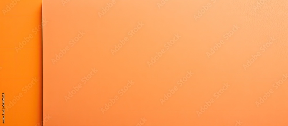 Aufkleber wall features single bright orange square, contrasting with white surface. smooth orange paper nearb