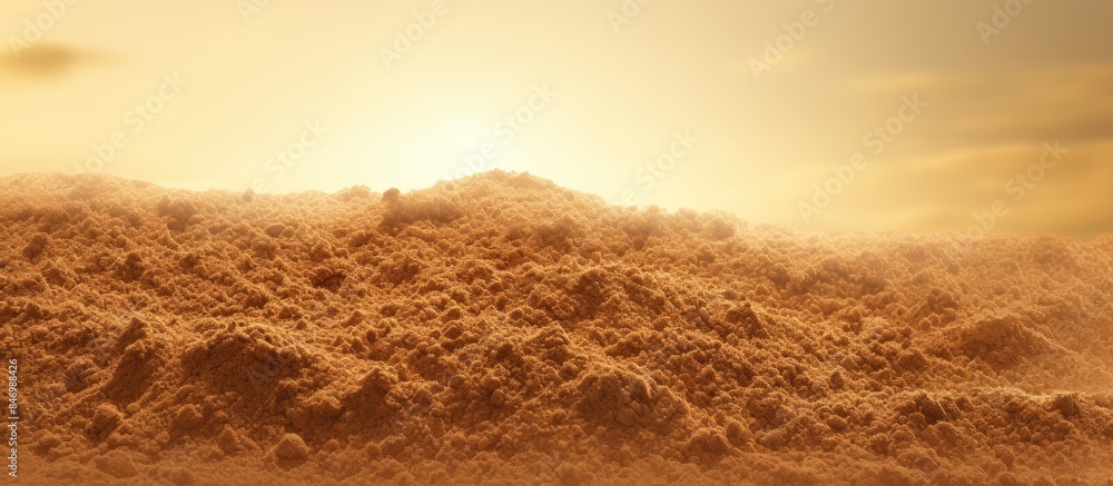 Fototapete Sand pile textured background illuminated by the warm light of the setting sun. with copy space image. Place for adding text or design
