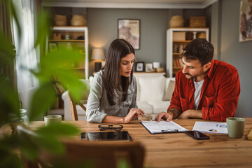 woman financial adviser explain the insurance policy to the men client