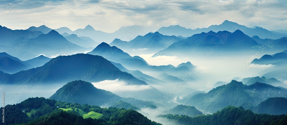 Poster View of mountain range under a sky with a few clouds, creating a serene landscape. with copy space image. Place for adding text or design