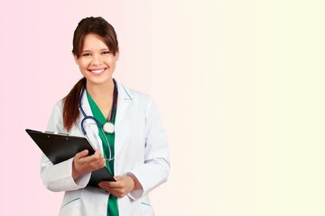 Cheerful woman doctor hold clipboard