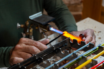 Murano Glassblowing Artisan in Venice, Traditional Handmade Craftsmanship, Glass Working Techniques, Creative Process in Murano Italian Island Workshop, Flame and Heat Manufacturing Skillful Craftsman