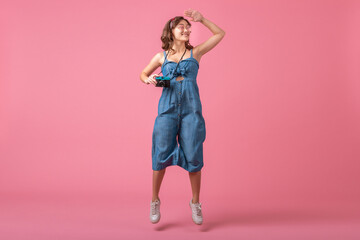 attractive smiling happy woman posing with vintage photo camera