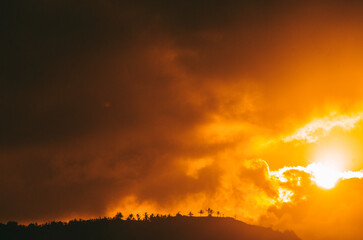 Golden sun against the clouds.