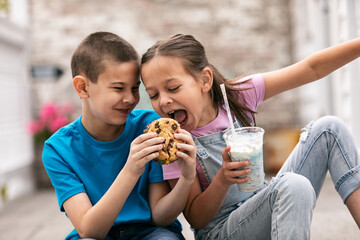 Gril Tries To Get Bite Of Brother's Ice Cream Cookie